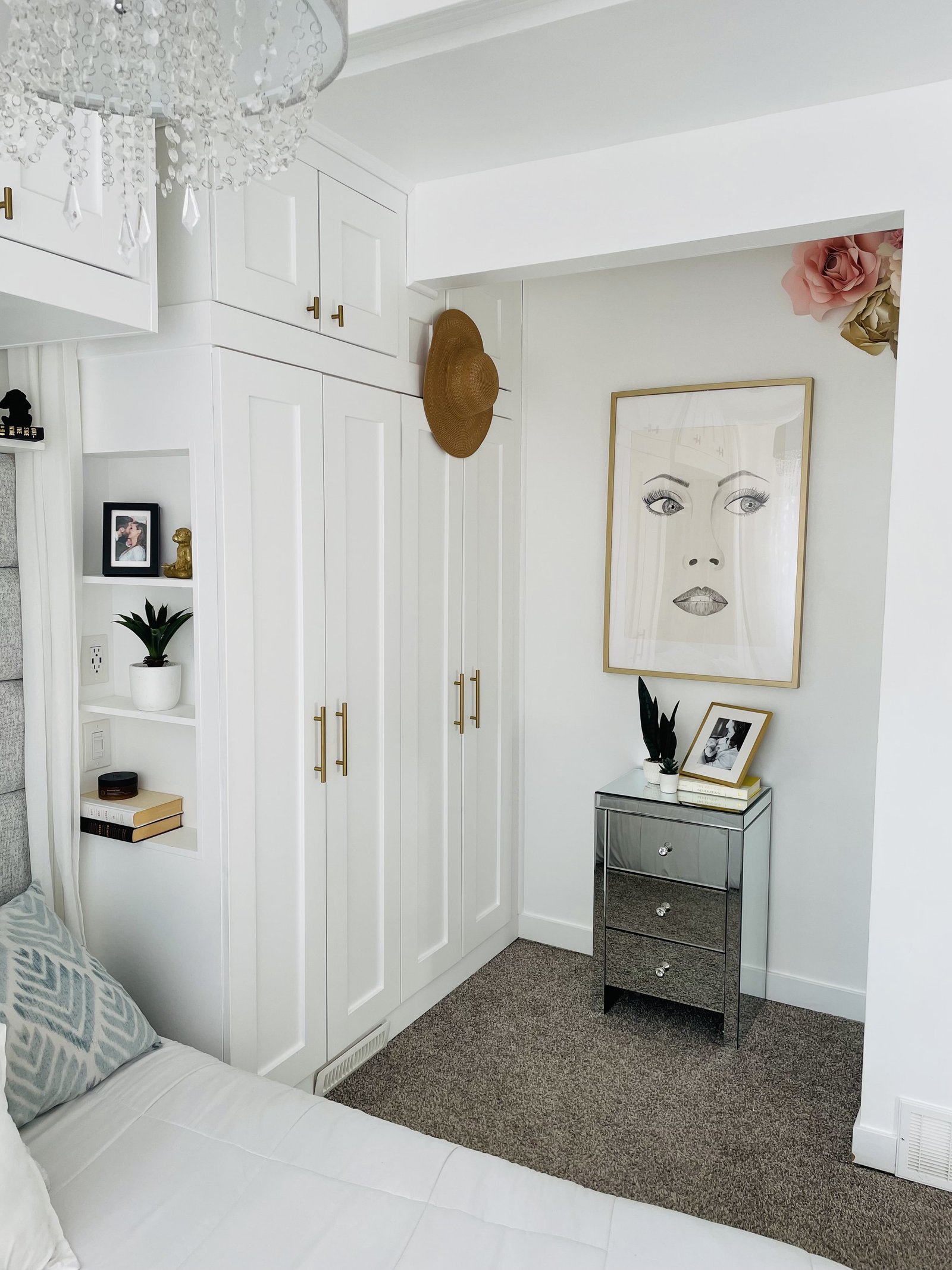 built in wardrobes around bed with shelf nook